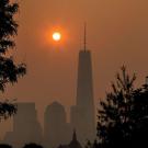 The sun rising over New York City while wildfire smoke covers the city